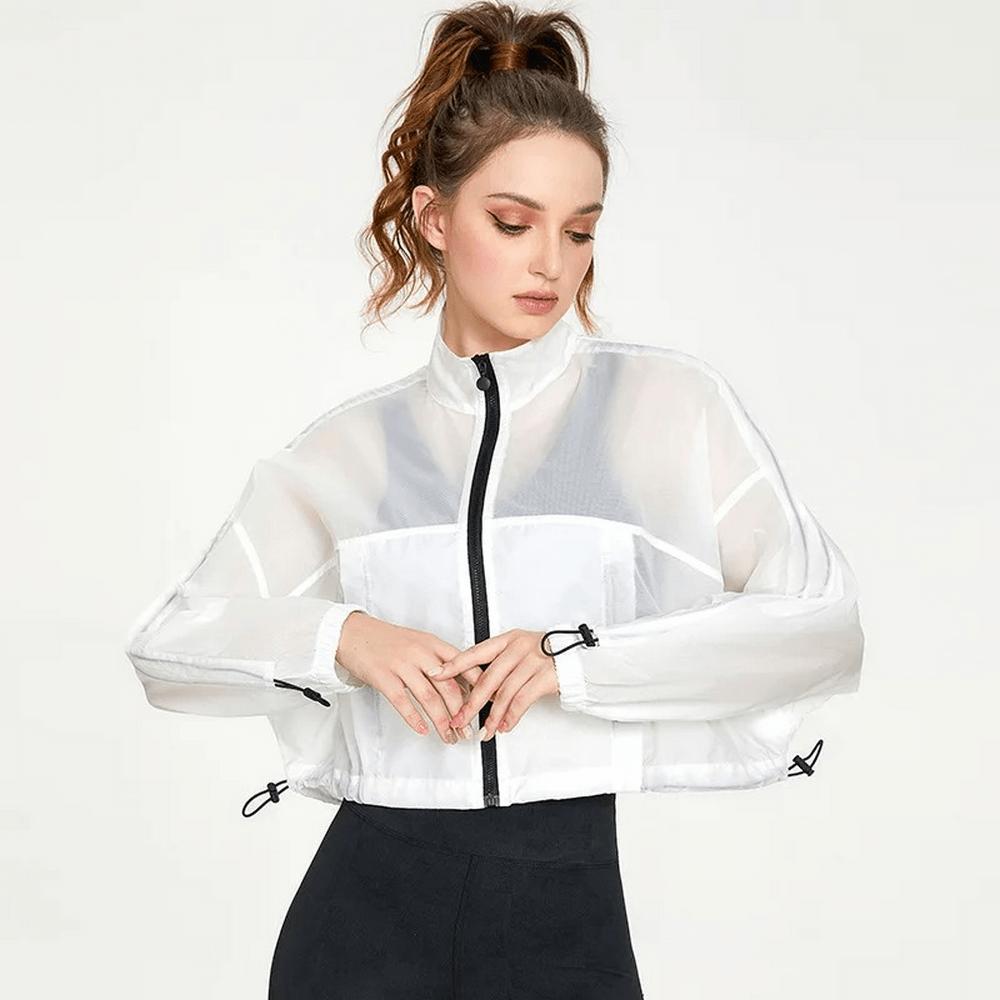 Woman wearing a stylish neon windbreaker with full sleeves, showcasing elegant design and breathable fabric perfect for workouts.